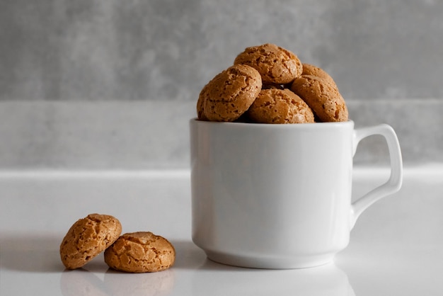 White cup filled with cookies sweets pastries