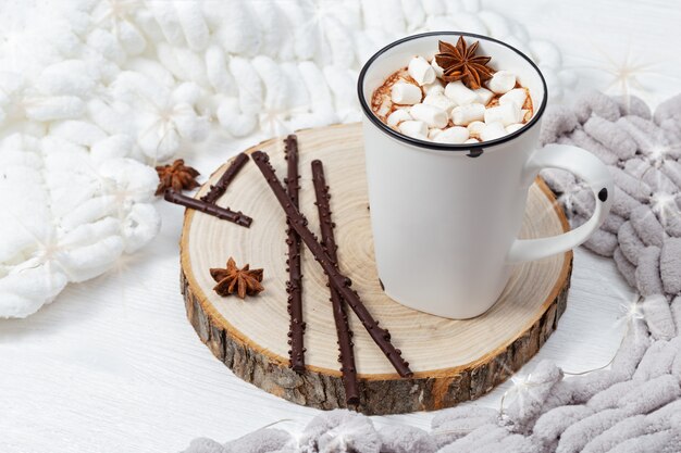 White cup of hot cocoa with marshmallows 