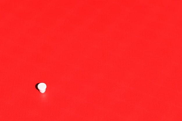 White cup on red background