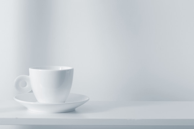 White cup on white space