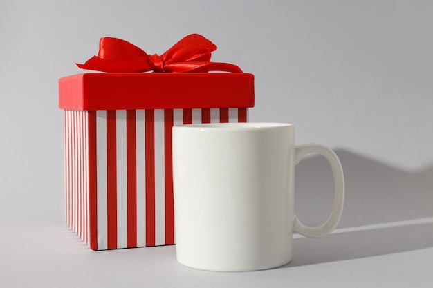 A white cup with a beautiful gift