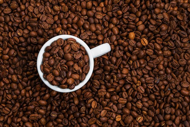 White cup with coffee beans