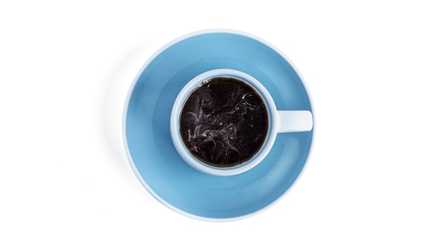 Photo white cup with coffee on blue saucer on a white background