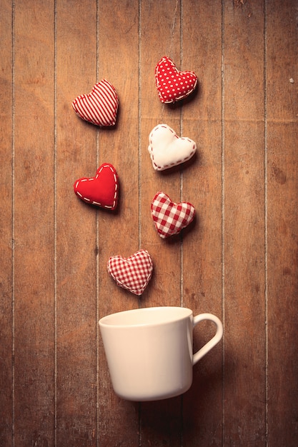 White cup with heart shapes 