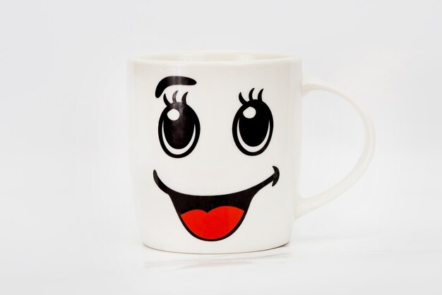 White cup with a smiley face Smiley White mug with a pattern Smile cup of coffee