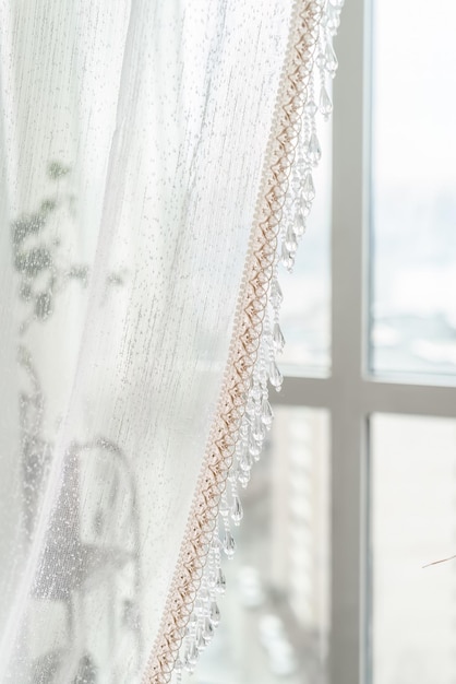 a white curtain with a flower on it