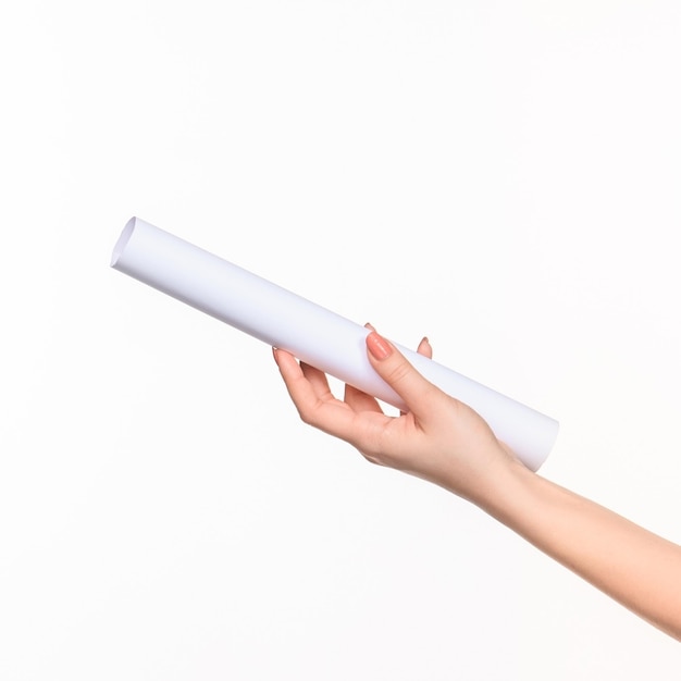 The white cylinder of the props in the female hands on white background with  right shadow