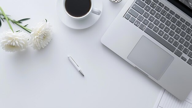 White desk with Laptop blank notepad flower coffee cup and pen Flat lay top view co Generative AI