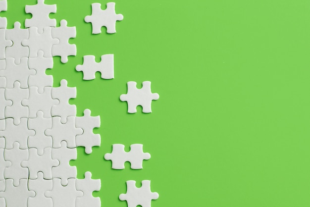 White details of puzzle on green