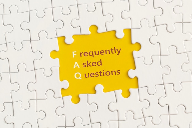 White details of puzzle with the text FAQ on yellow background.