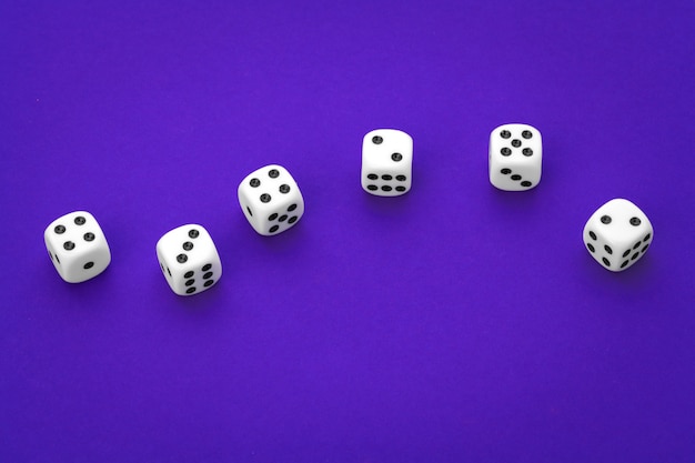 White dices against a blue 