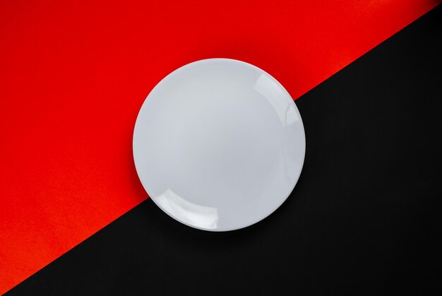 White dish on a black and red background