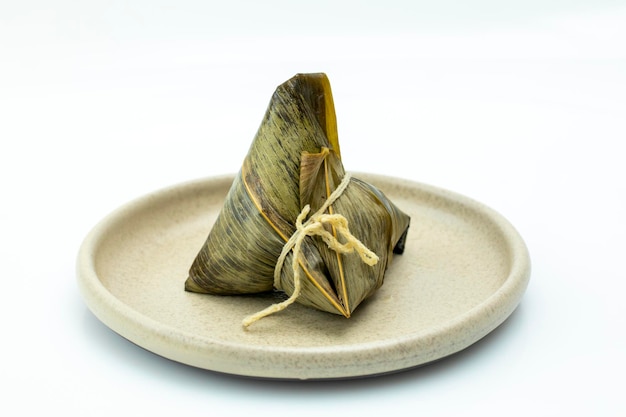 White disk one steaming hot meat dumplings white background on the table