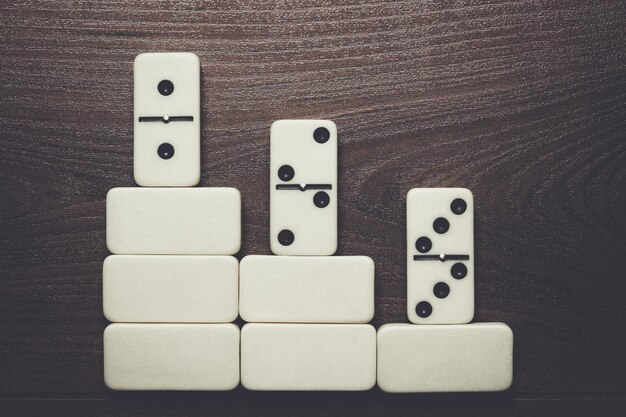 white domino pieces win concept background