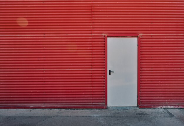 White door in a red wall