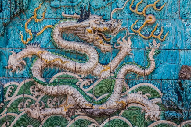 White dragon with green crest on the wall