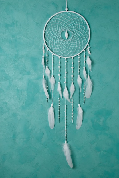 White dream catcher on aquamarine 