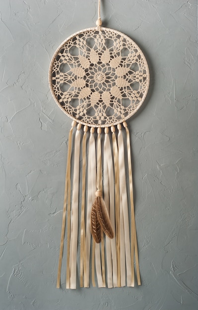 White dream catcher on wall