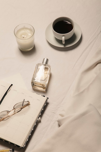 Photo white dress coffee and accessories on a white background the concept of a stylish image