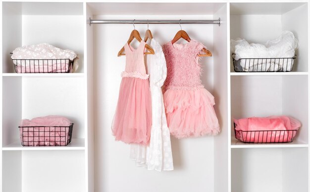 Photo white dressing room with lush carnival dresses storage organization concept