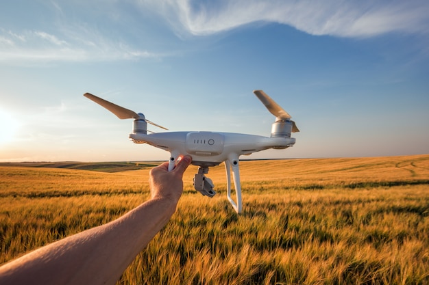 The white drone in hands at the man isolated