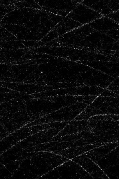 White dust particles and scratch lines on a black concrete wall surface for background