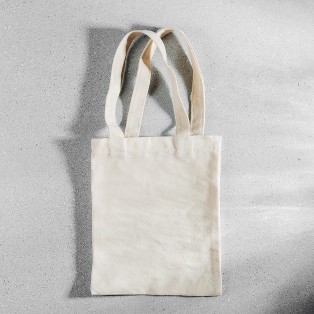 Photo white eco bag mockup, shopping sack blank template with copy space.