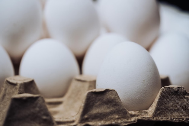 White eggs in cardboard packing Group of eggs packed