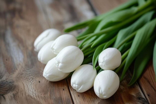 White eggs with tulips on table
