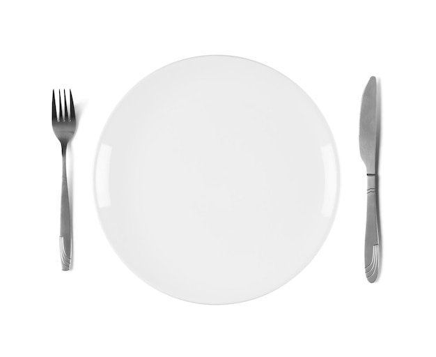 White empty ceramic plate with fork and knife isolated on white background