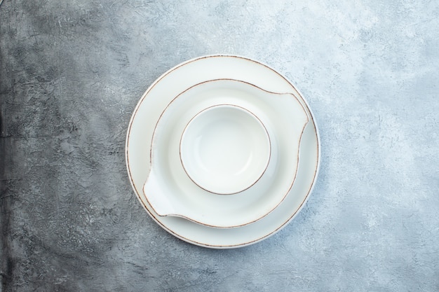 White empty dinnerware set on half dark light gray surface