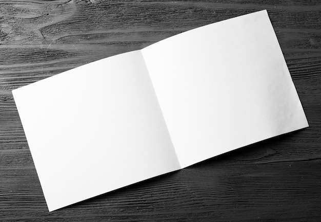 White empty paper on dark wooden background