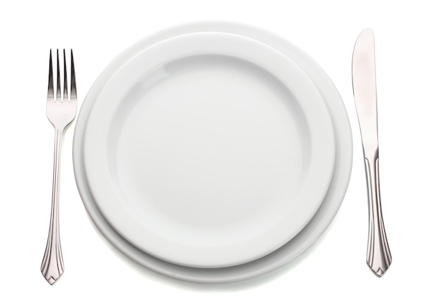 Photo white empty plate with fork and knife isolated on white