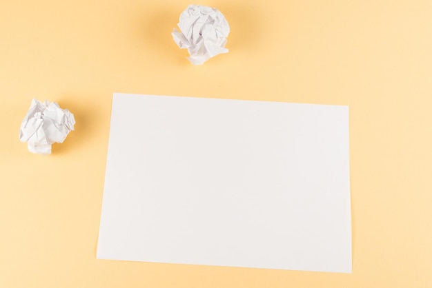 Photo white empty sheet of paper on beige background copy space