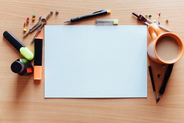 White empty sheet with lots of stationery objects 