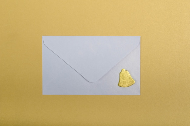 White envelope and golden bell