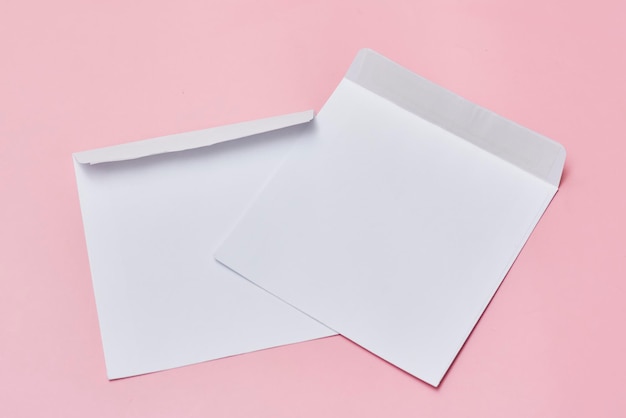 A white envelope and a piece of paper on top