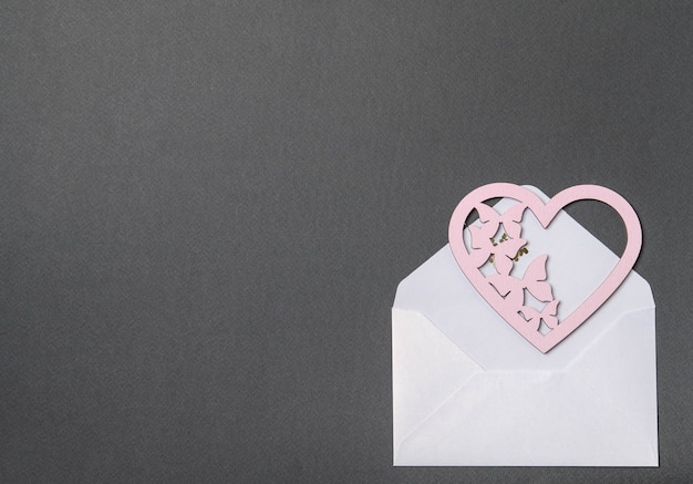 White envelope, pink card and hearts