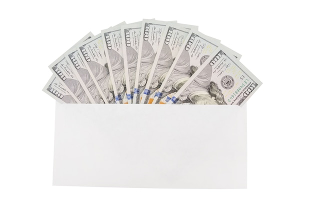 White envelope with dollars on a wooden background. Financial concept.