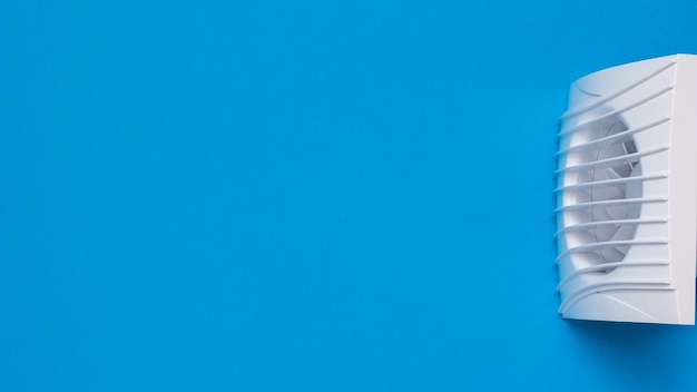 White exhaust fan on a blue background