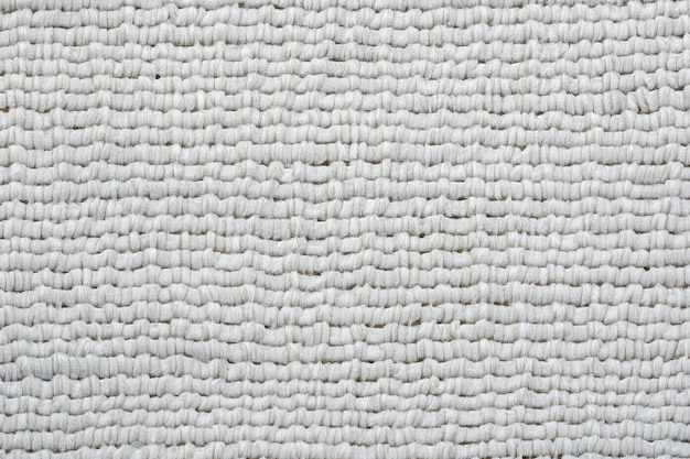 White fabric knitted rough texture background