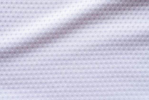 Foto maglia da calcio per abbigliamento sportivo in tessuto bianco con sfondo a trama in rete d'aria