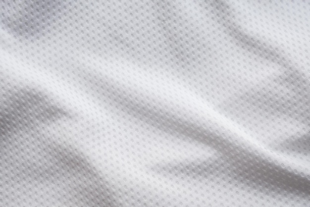 エアメッシュテクスチャ背景を持つ白い生地のスポーツ服サッカージャージ