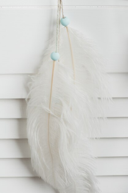 White feathers with mint beads