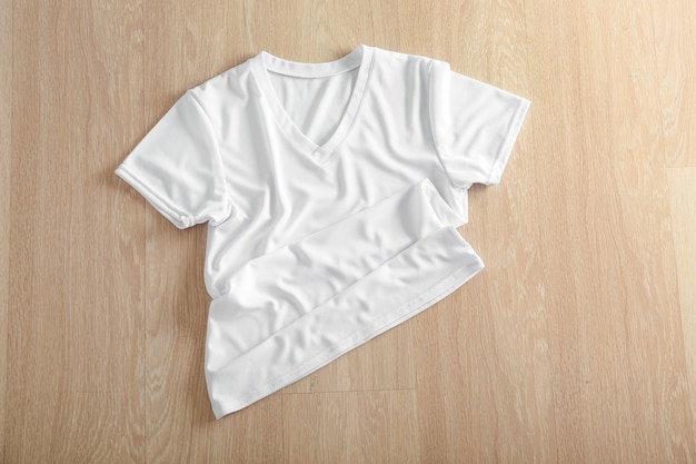 White female t-shirt on wooden space