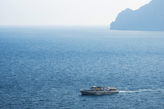  White ferry in the sea on a sunny day blue water