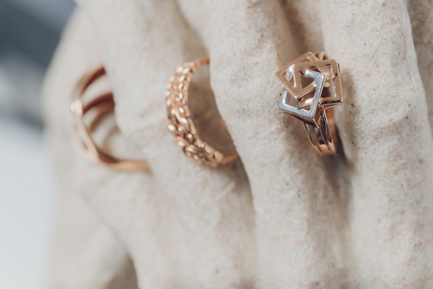 White figurines with wedding rings on closeup