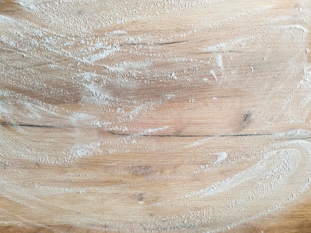 White flour on wooden table Free space for text View from above Top view