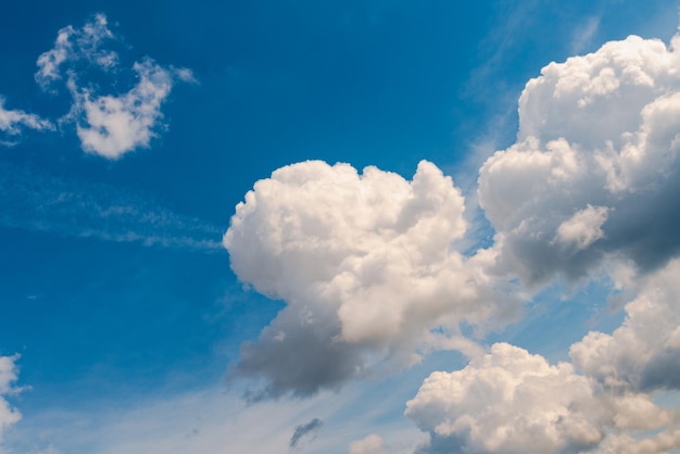 White fluffy clouds in blue sky background from clouds