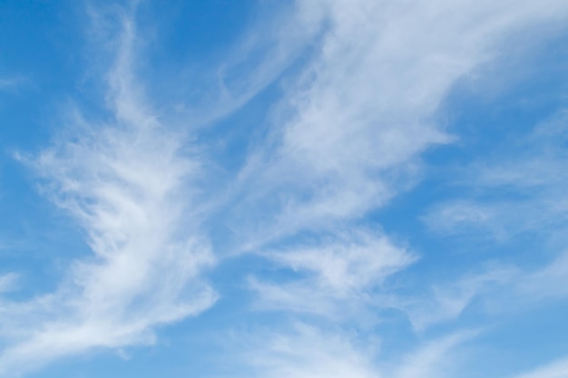 White fluffy clouds in the blue sky Blue sky background and white clouds soft focus pastel sky